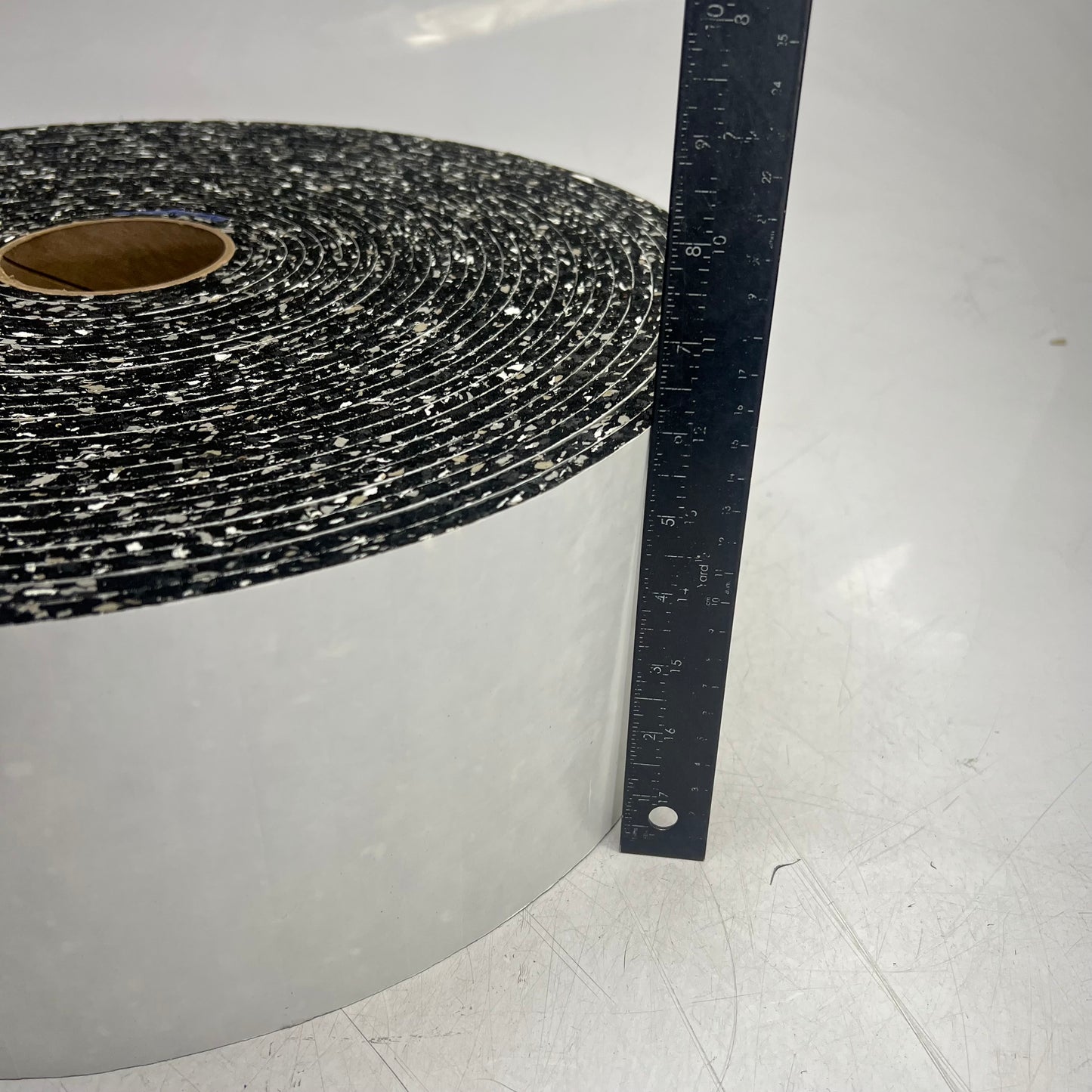 (9,000 PIECE ROLL) Neo Rebond W/ Removable Adhesive Pads 1/4 x 3/4 x 3/4 Speckle