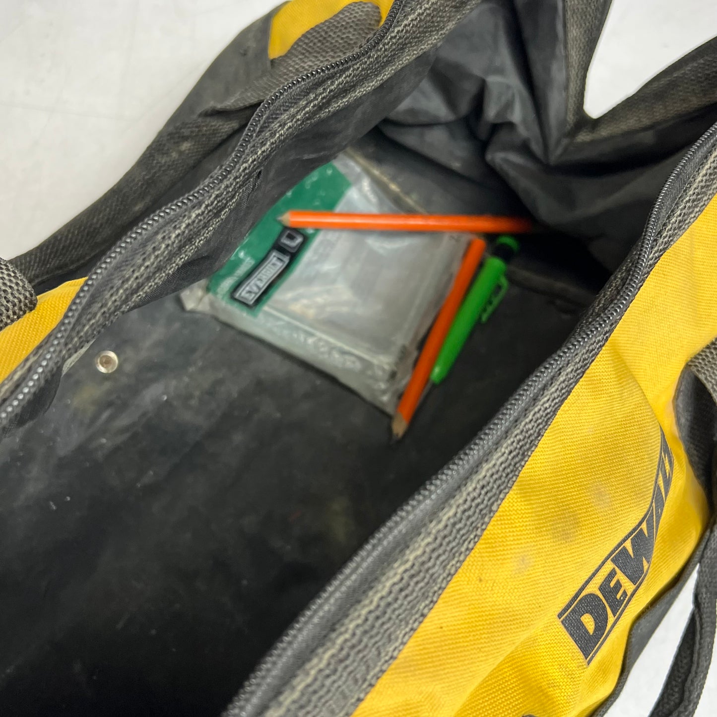 ZA@ DEWALT Square Open Tool Bag W/ Assorted Tape, Sandpaper Safety Vest & More (Used)