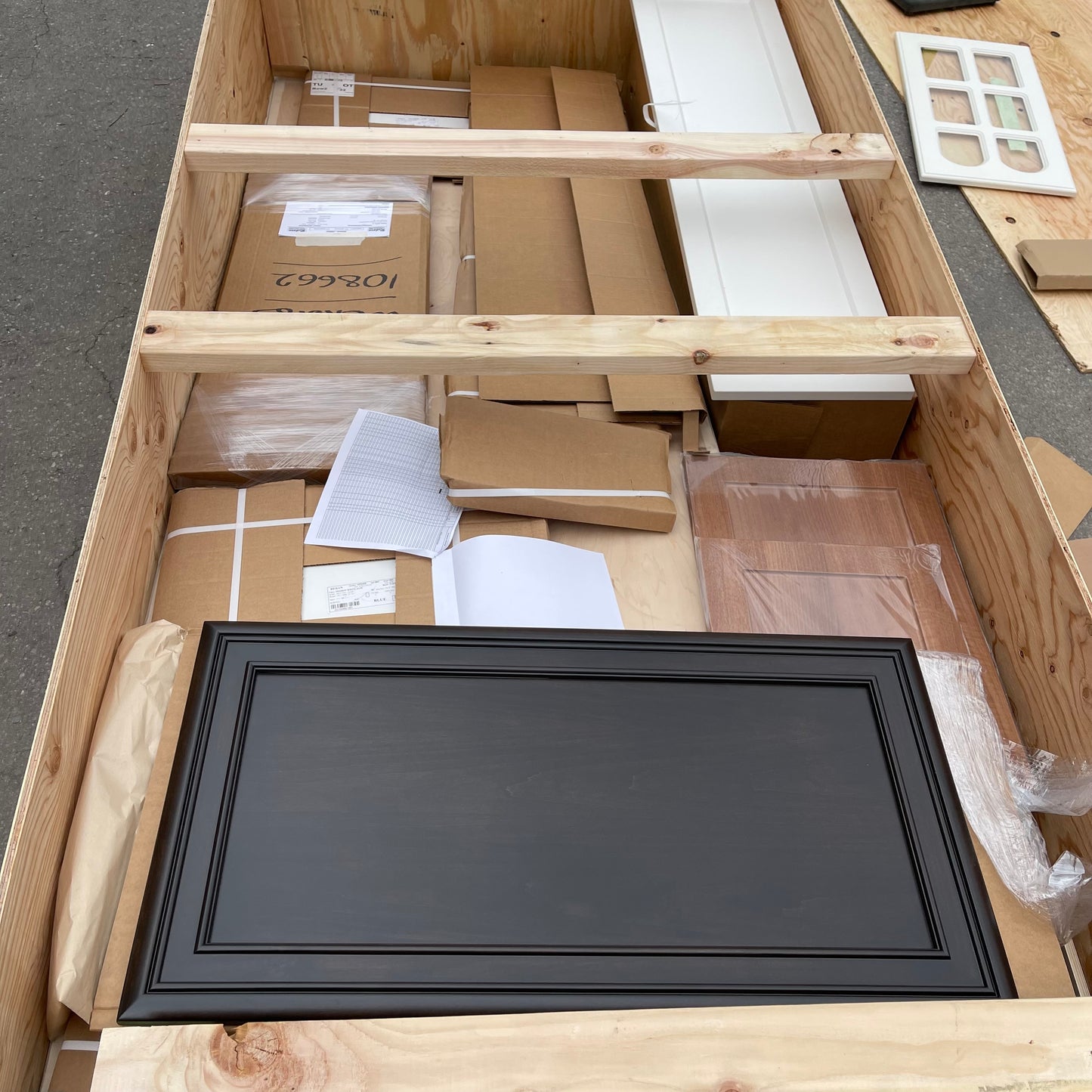 ZA@ Pallet of REBORN CABINETS Pressed Wood Cabinetry Parts Black, White, Walnut (AS-IS)