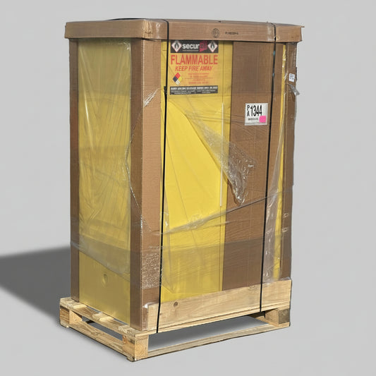 Large flammable storage cabinet on a pallet with visible labels in an outdoor setting.