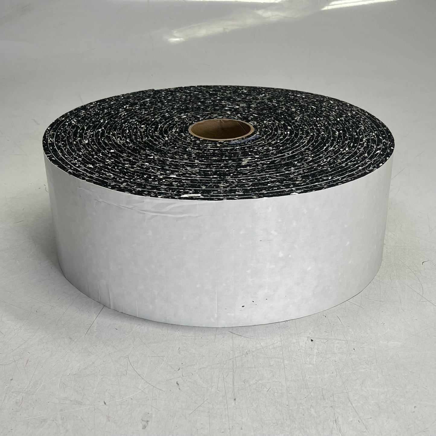 (9,000 PIECE ROLL) Neo Rebond W/ Removable Adhesive Pads 1/4 x 3/4 x 3/4 Speckle