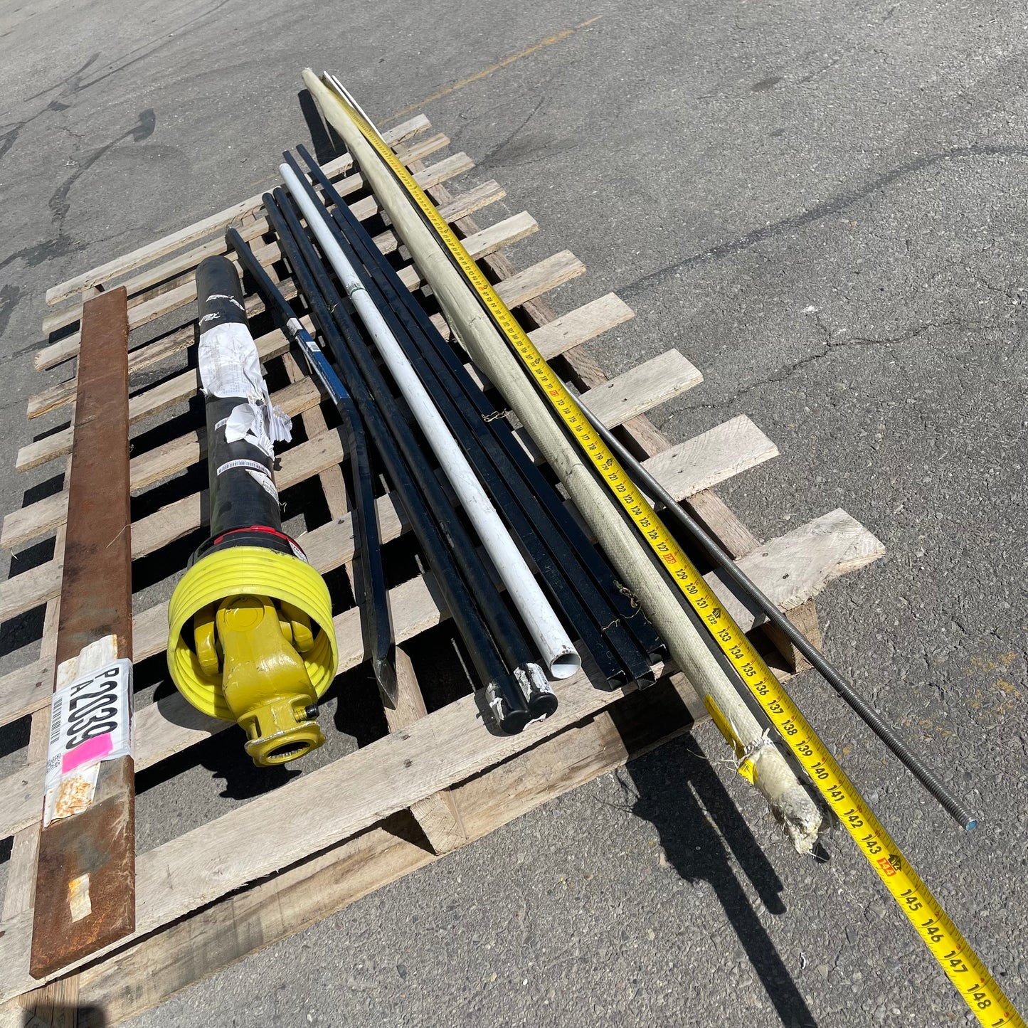 ZA@ Pallet of MIXED Steel Rods, Pipes, Bent Pry Bar, & Drive Shaft (AS-IS)