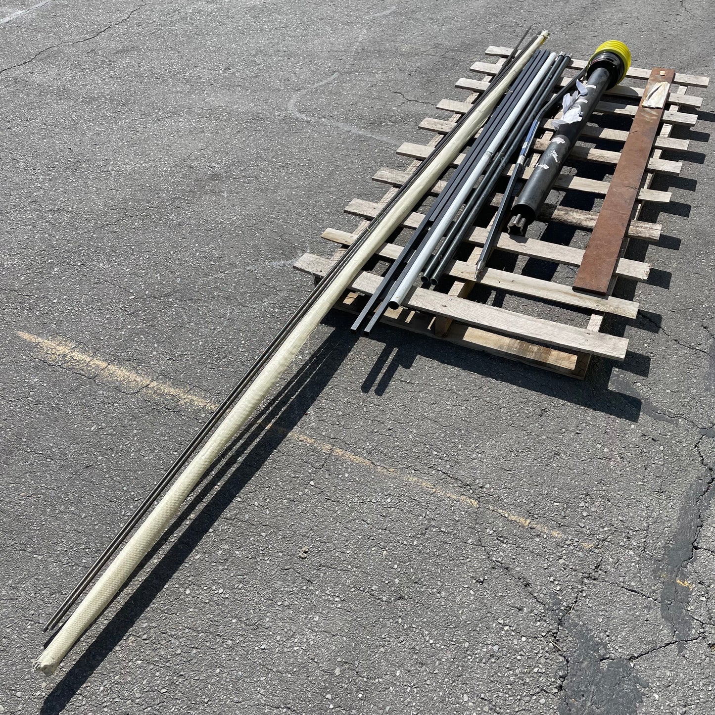 ZA@ Pallet of MIXED Steel Rods, Pipes, Bent Pry Bar, & Drive Shaft (AS-IS)