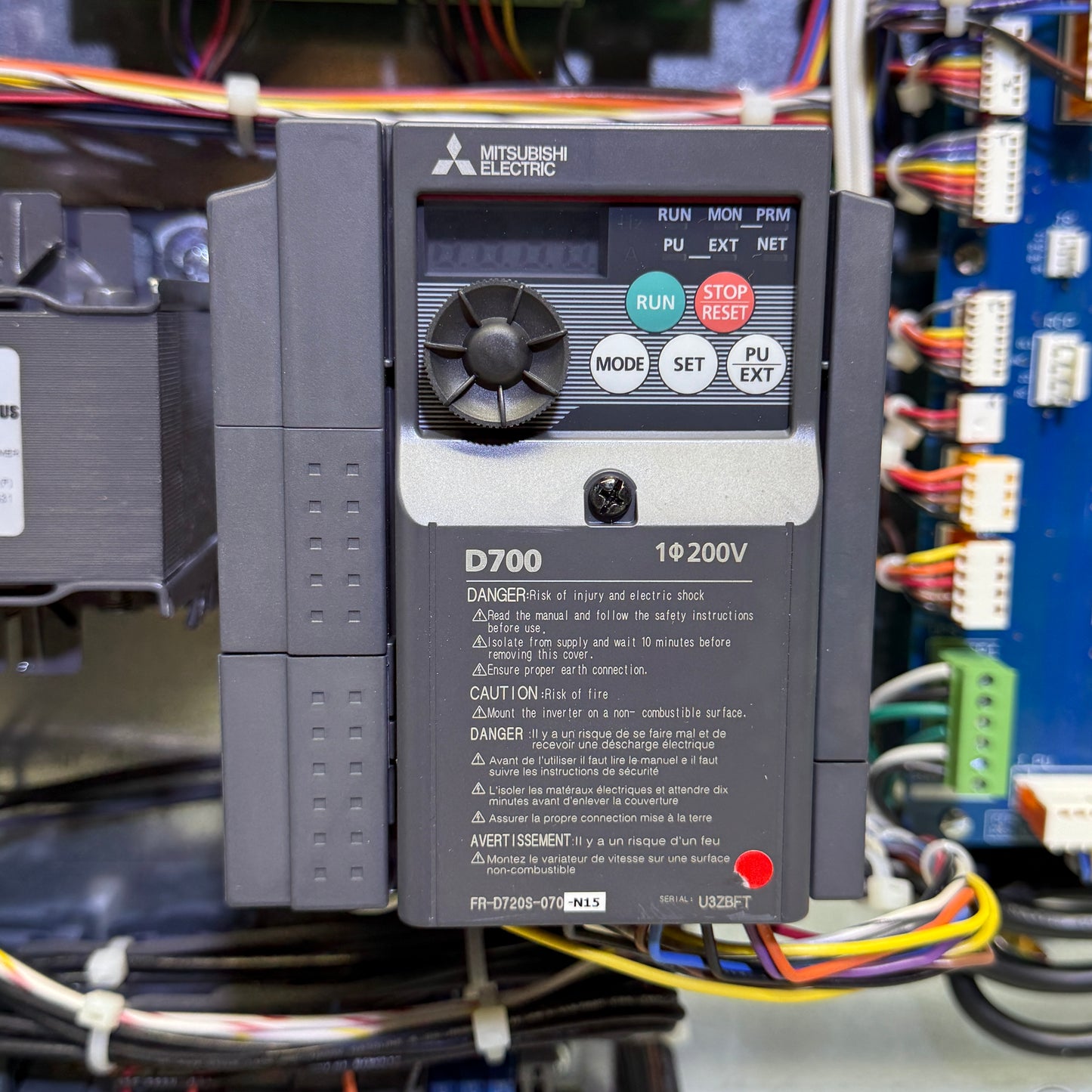 Mitsubishi Electric control panel with wiring in an industrial setting