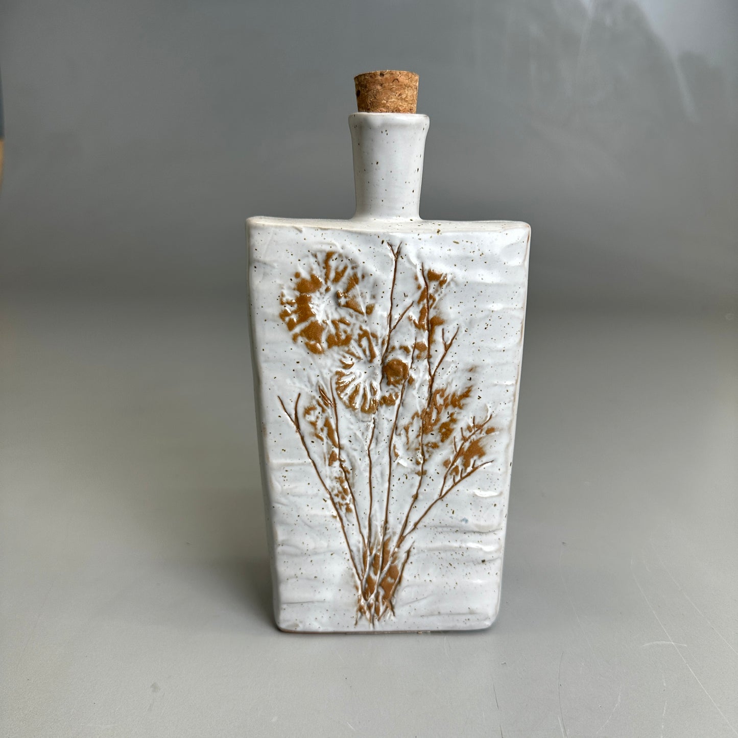 8" Embossed Stoneware Bottle w/Flower & Cork Stopper White