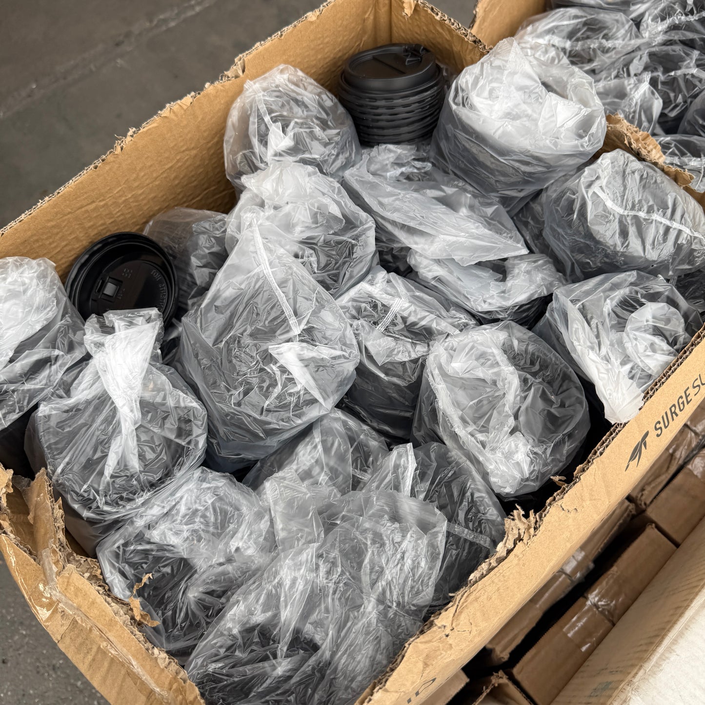 ZA@ Pallet of FIRST MARK Clear Lids, Black Hot Cup Lids, Tortilla Strips, & Toilet Seat Covers