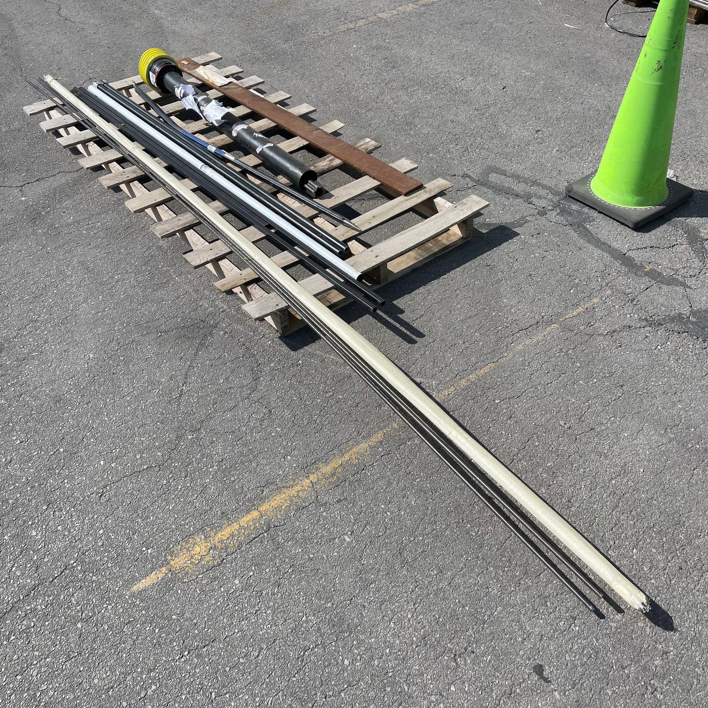 ZA@ Pallet of MIXED Steel Rods, Pipes, Bent Pry Bar, & Drive Shaft (AS-IS)