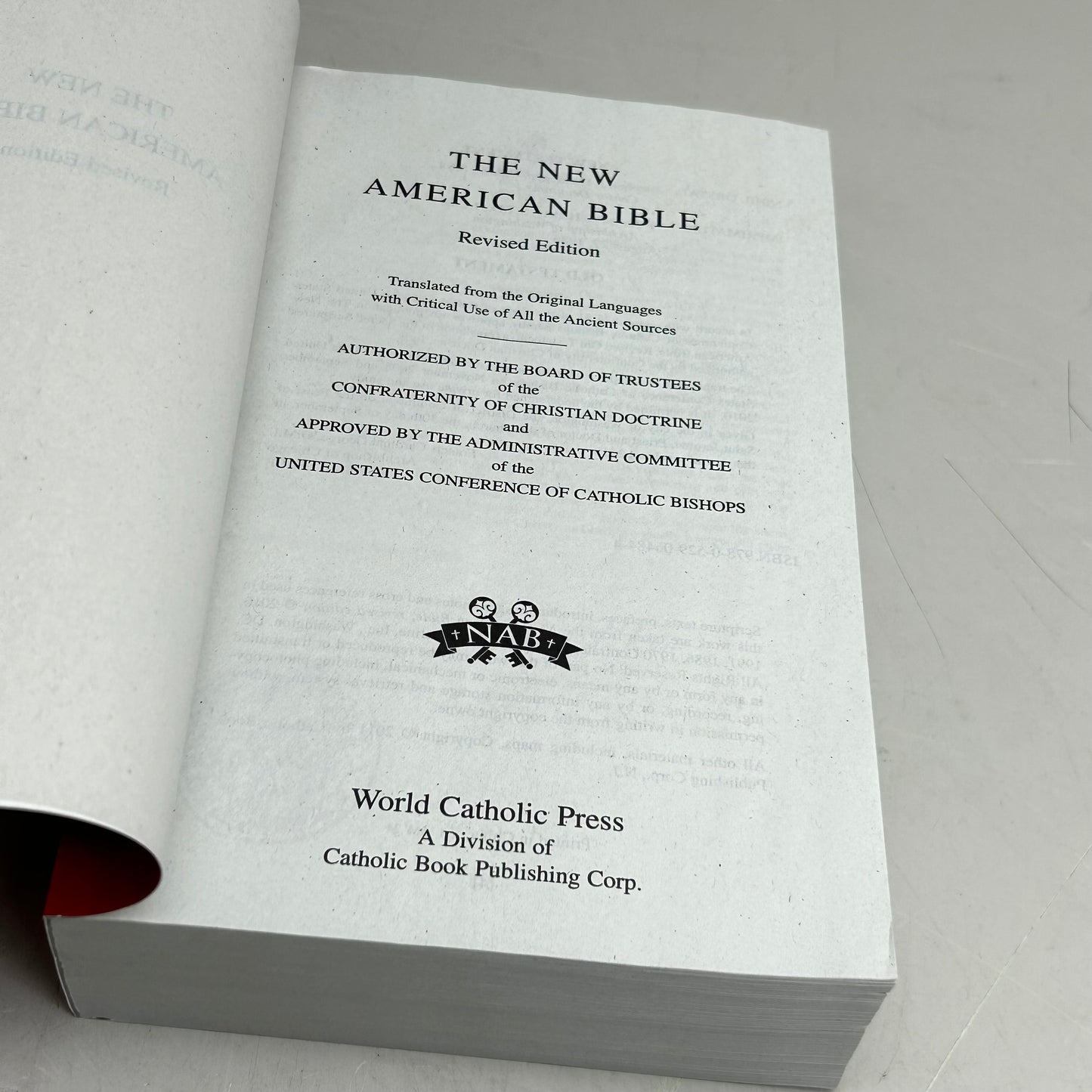 WORLD BIBLE PUBLISHING The New American Bible Revised Edition  1394 Pages Red