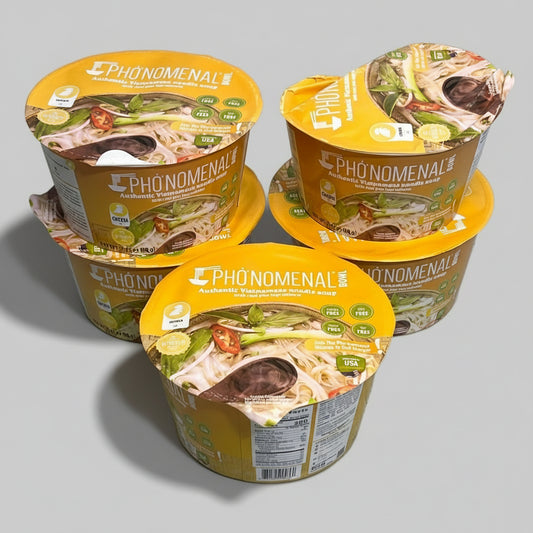 Four containers of Phenomenal Pho on a metallic surface