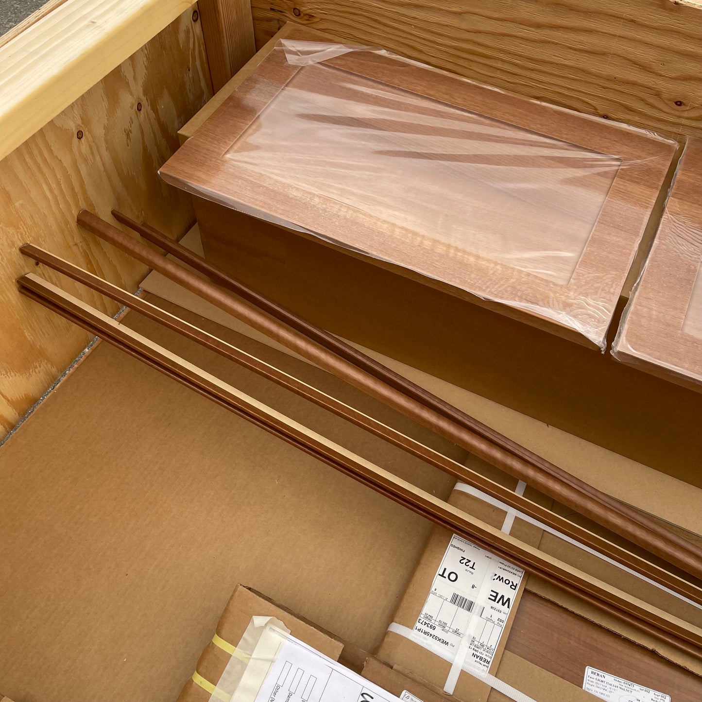 ZA@ Pallet of REBORN CABINETS Pressed Wood Cabinetry Parts Black, White, Walnut (AS-IS)