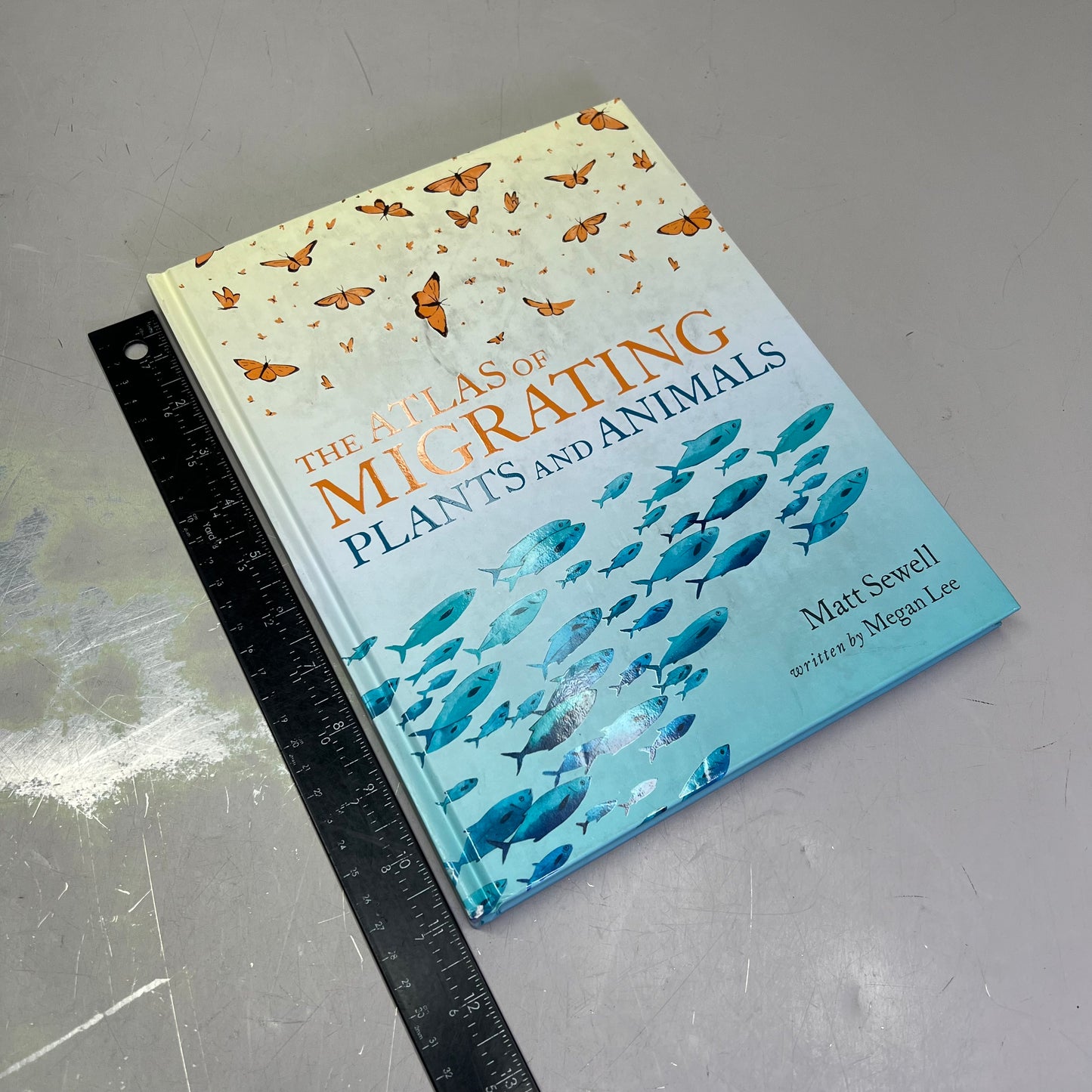 THE ATLAS OF MIGRATING PLANTS & AMINAL Hardback Book By Megan Lee (As-is)