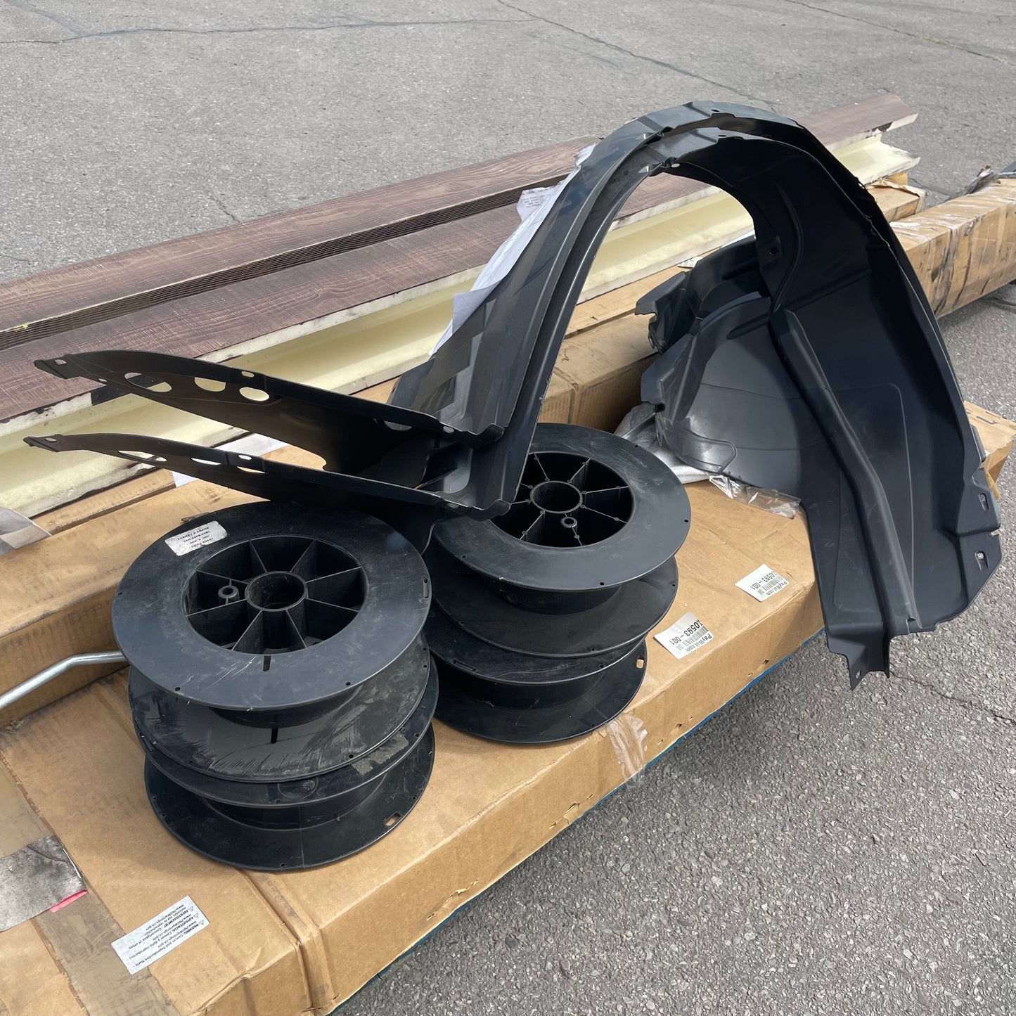 ZA@ Pallet of MIXED Plastic Channels, Faux Wood Trim, Fender Liners, Shelf Parts, & More! (AS-IS)