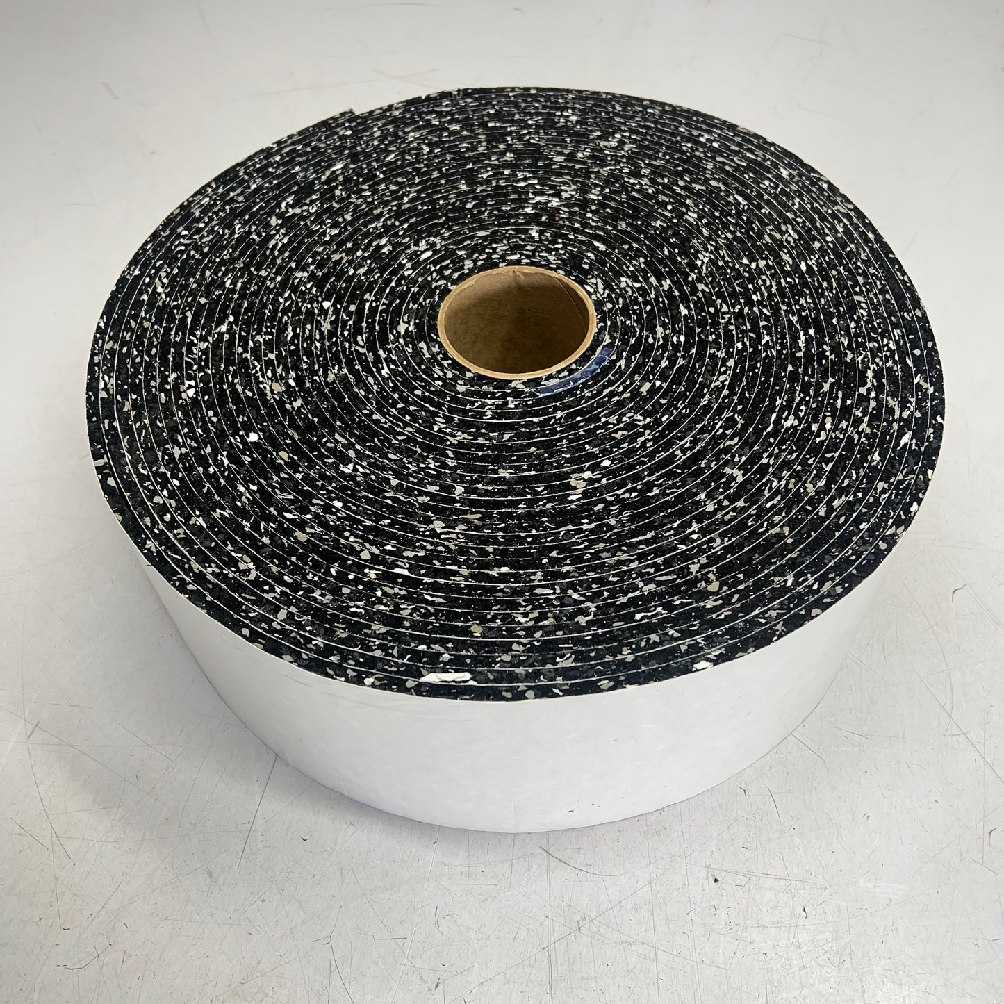 (9,000 PIECE ROLL) Neo Rebond W/ Removable Adhesive Pads 1/4 x 3/4 x 3/4 Speckle