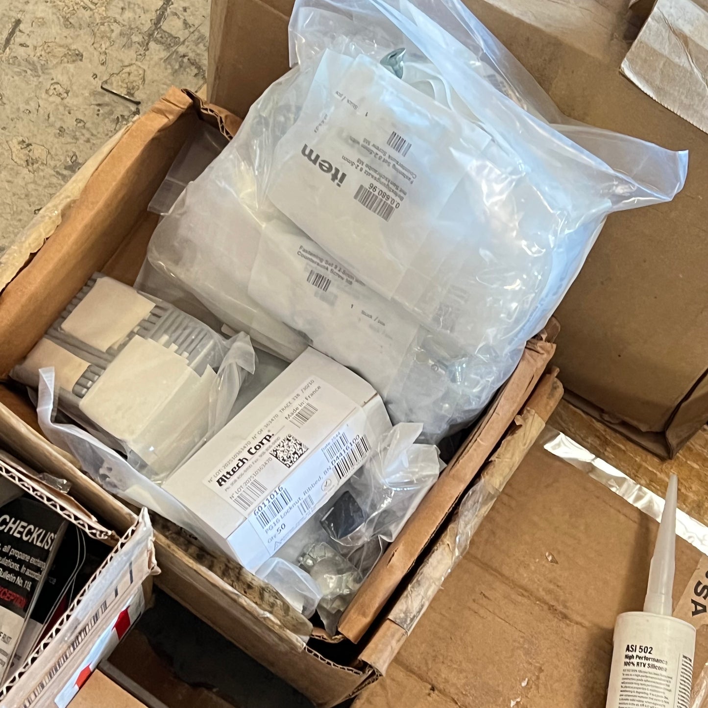 ZA@ Pallet of MIXED Hardware, Brackets, Plastic Tarp, Steel Horse Shoes, Lamination Sheets, & More!!!!! (AS-IS)
