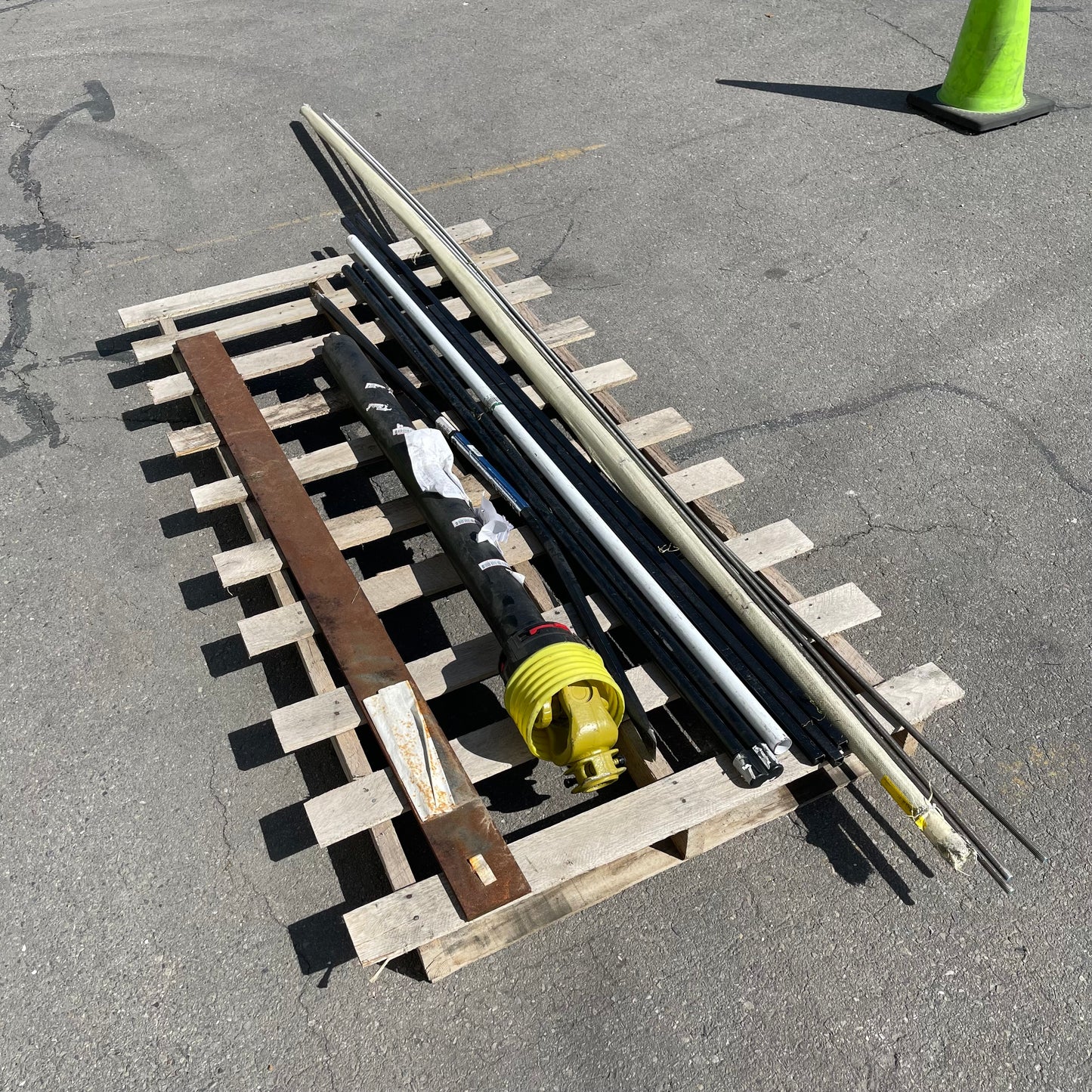 ZA@ Pallet of MIXED Steel Rods, Pipes, Bent Pry Bar, & Drive Shaft (AS-IS)