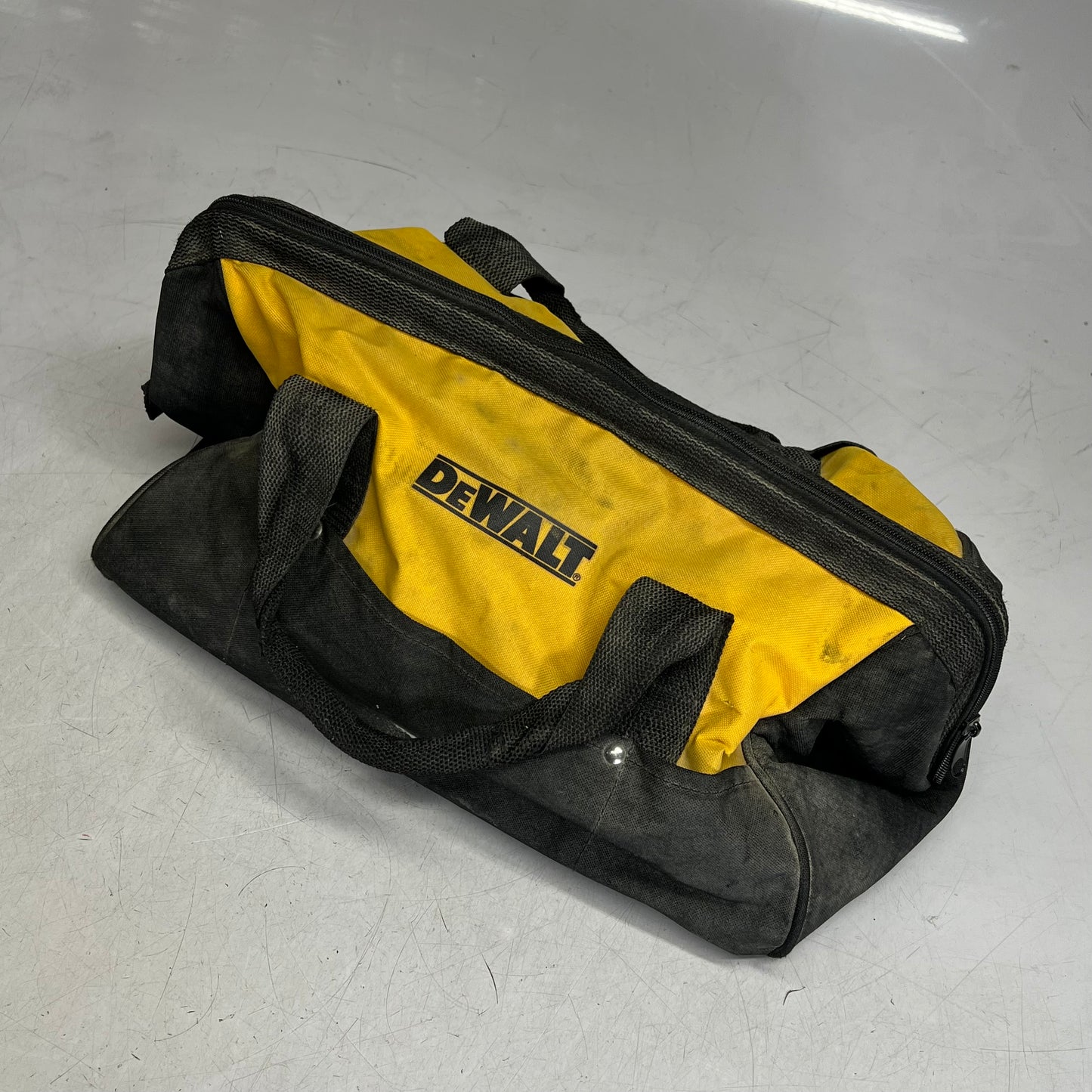 ZA@ DEWALT Square Open Tool Bag W/ Assorted Tape, Sandpaper Safety Vest & More (Used)